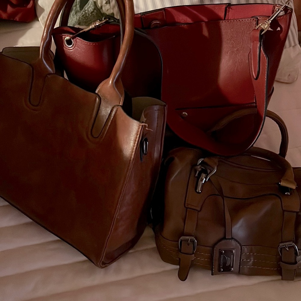 3 Hand Bags. Red, camel brown and just a shade lighter brown on the 3rd bag.